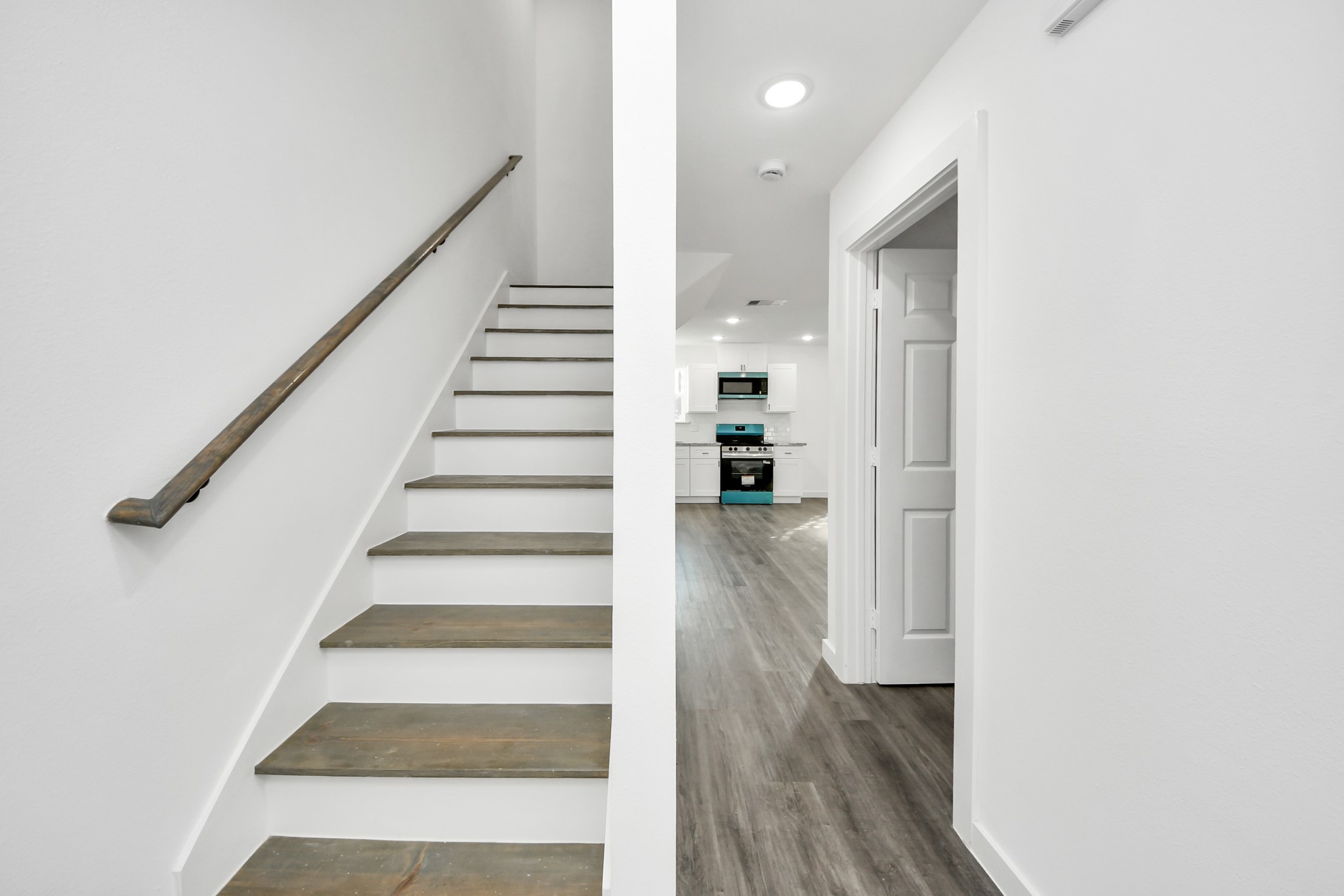2310 Wavell Street, Unit B Houston, TX 77088 - Photo 17 of 31 a view of entryway and hall with wooden floor