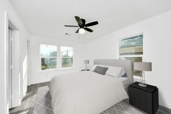 a bedroom with a bed and window