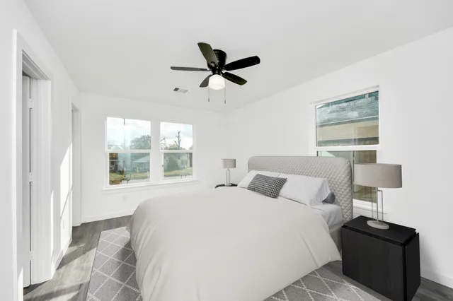 a bedroom with a bed and window