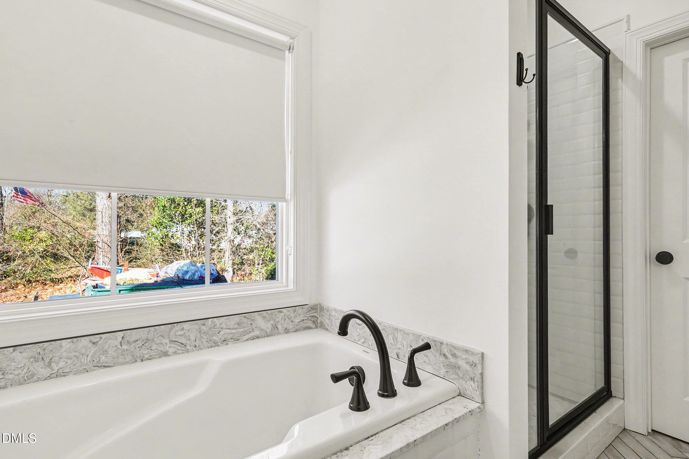 5117 Joe Ellen Road Battleboro, NC 27809 - Photo 21 of 29 a bathroom with a bathtub and window