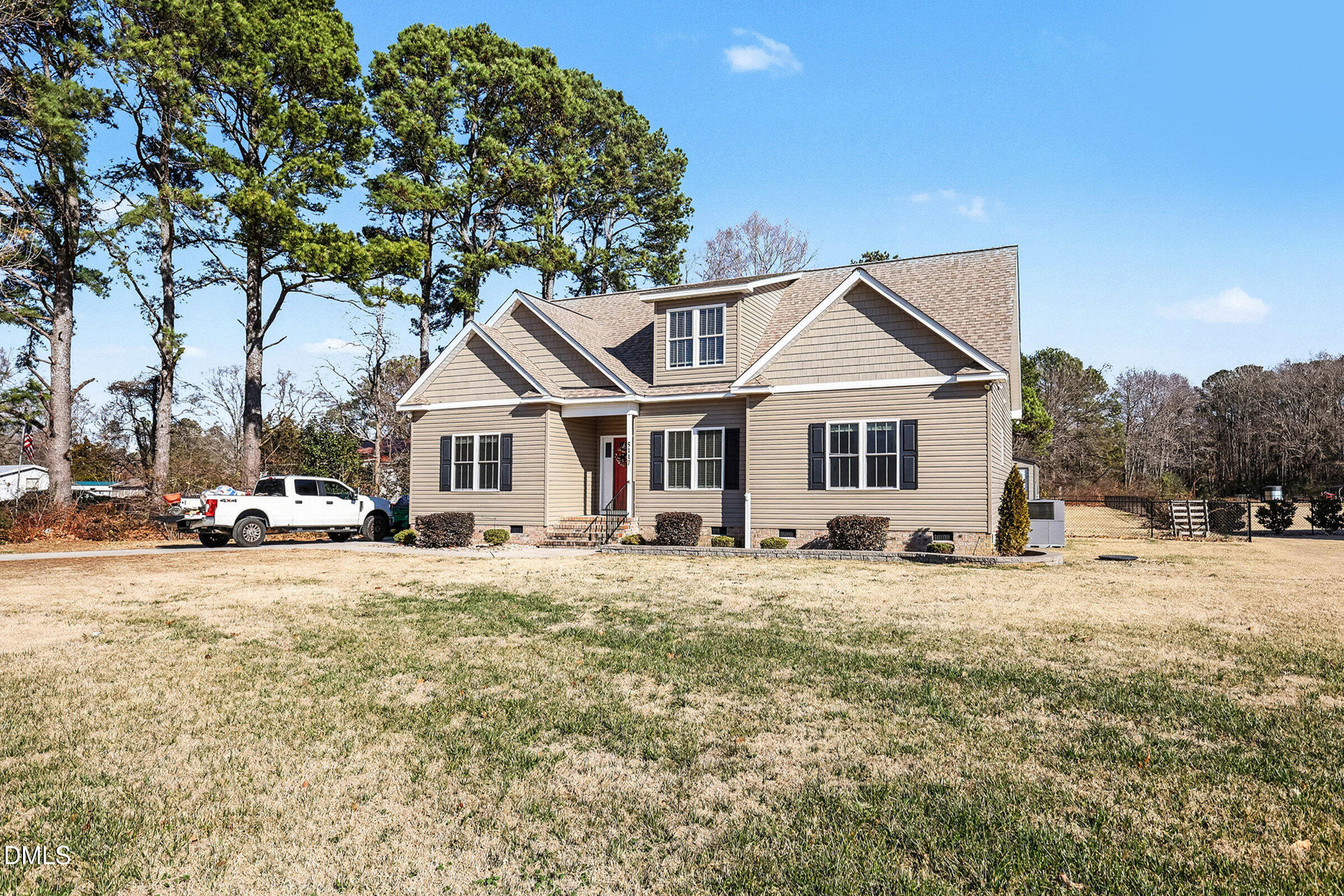 5117 Joe Ellen Road Battleboro, NC 27809 - Photo 24 of 29 a front view of a house with a yard and garage