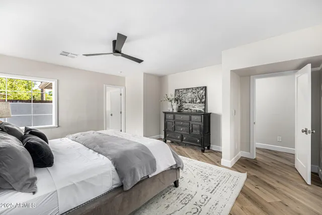 a porch with a table and chairs