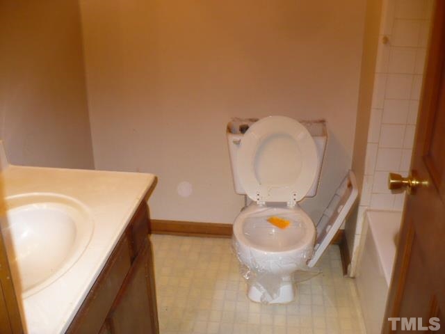 3105 Cinnamon Circle Raleigh, NC 27610 - Photo 14 of 16 a bathroom with a toilet and a sink