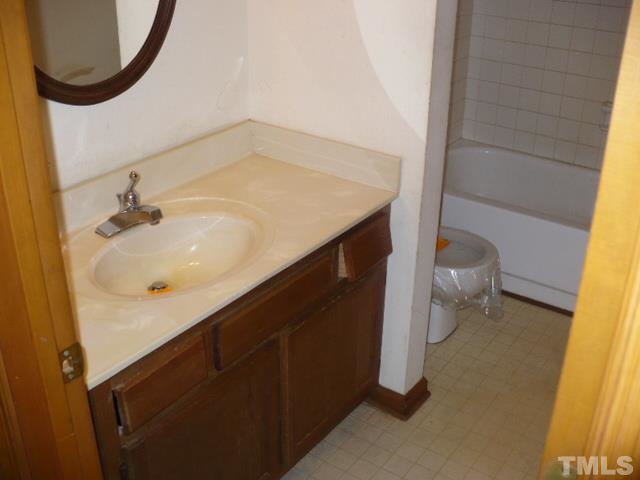 3105 Cinnamon Circle Raleigh, NC 27610 - Photo 8 of 16 a bathroom with a sink and a mirror