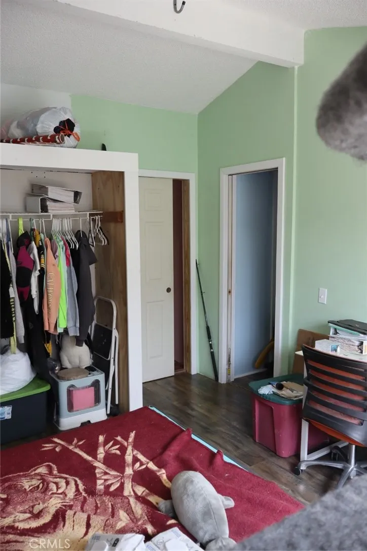 15325 Orange, Unit F16 Paramount, CA 90723 - Photo 13 of 25 a bedroom with a bed and a closet