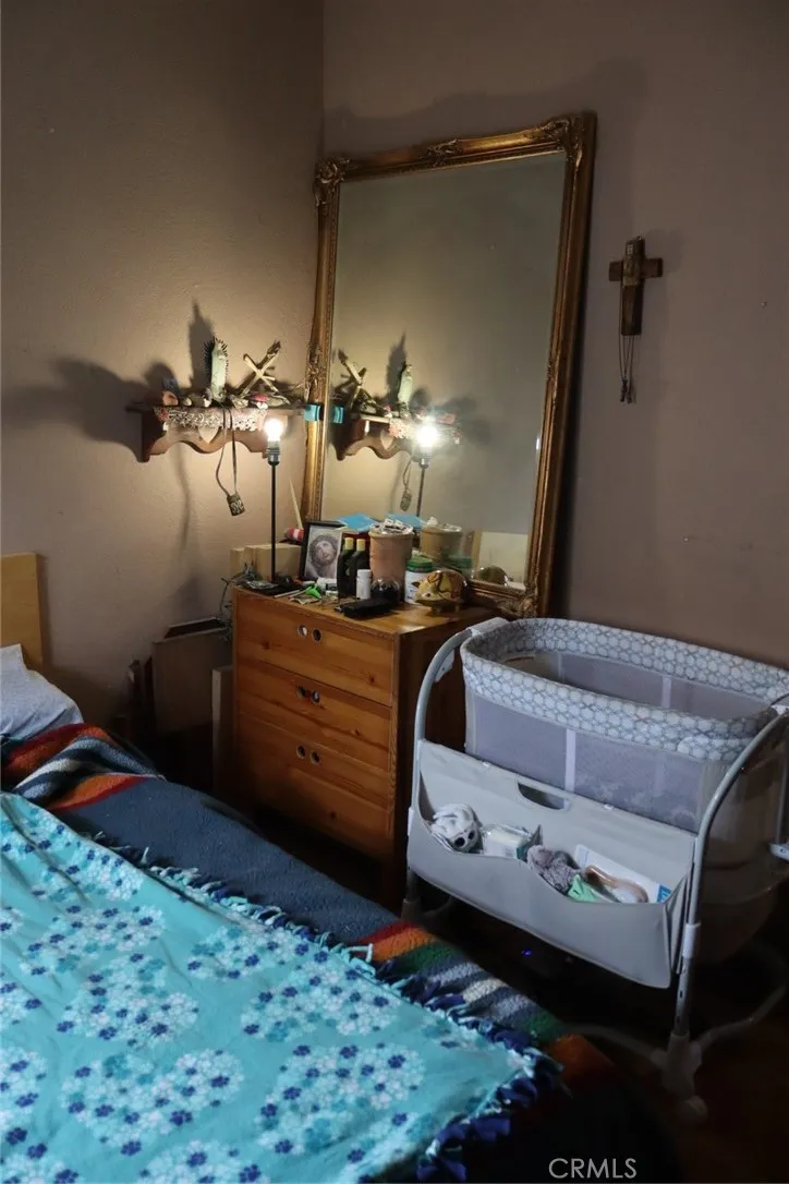 15325 Orange, Unit F16 Paramount, CA 90723 - Photo 14 of 25 a bedroom with a bed and bathroom