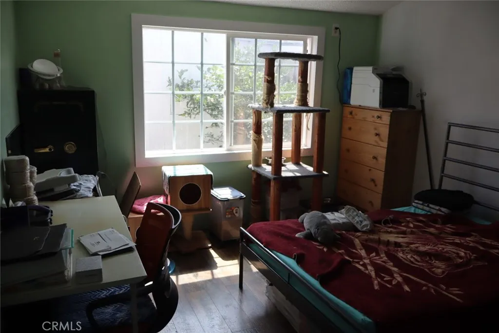 15325 Orange, Unit F16 Paramount, CA 90723 - Photo 16 of 25 a living room with furniture rug and lamp