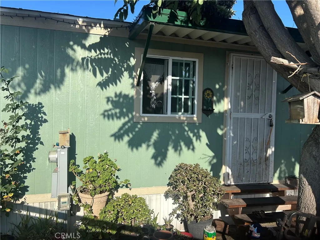 15325 Orange, Unit F16 Paramount, CA 90723 - Photo 2 of 25 a view of a backyard of the house