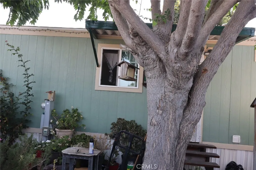 15325 Orange, Unit F16 Paramount, CA 90723 - Photo 4 of 25 a backyard of a house with seating space