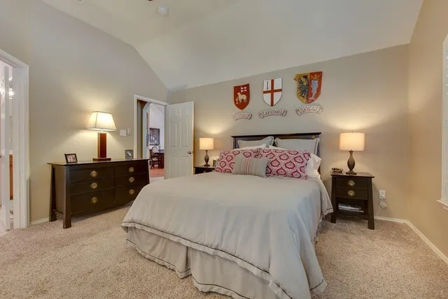 a bedroom with a bed and a night stand