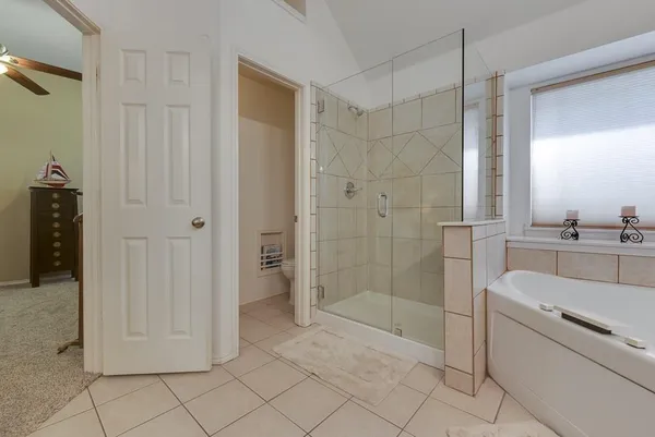 a bathroom with a shower and a sink