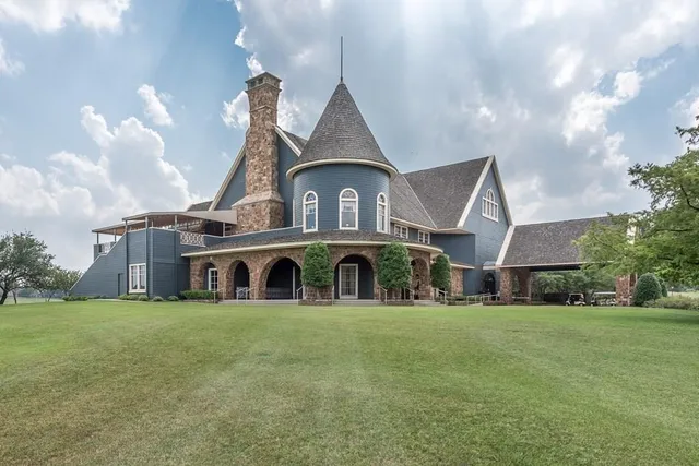 a view of a lake with houses in the background