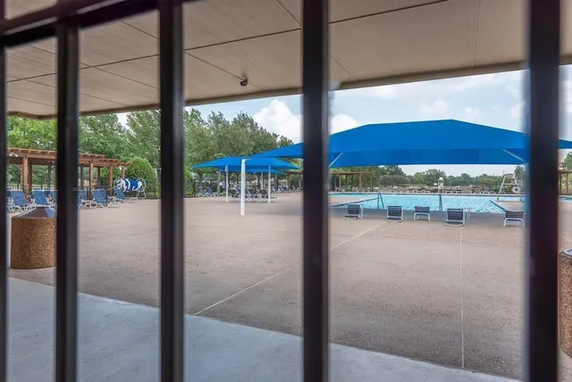 a view of an outdoor space and tennis court