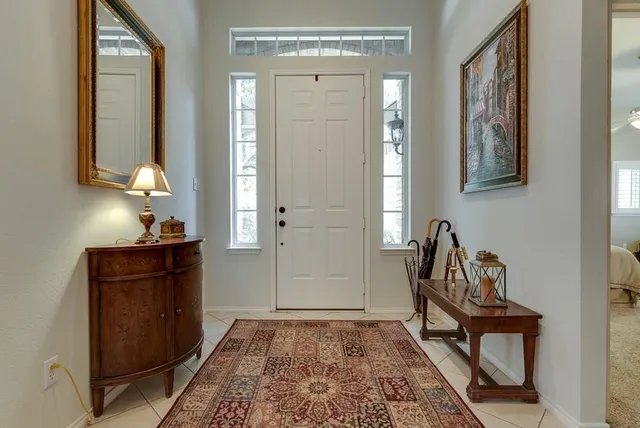 a living room with furniture and a rug