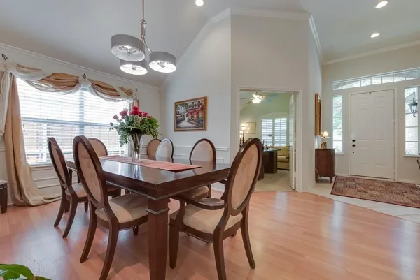 a view of a dining room with furniture and wooden floor