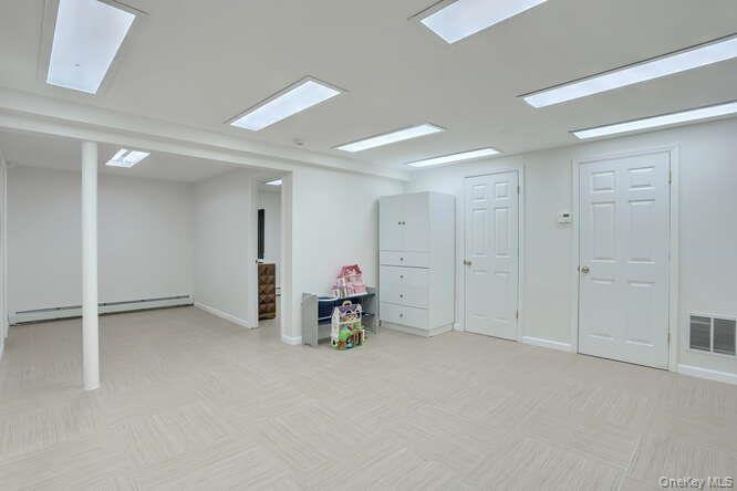 89 Spook Rock Road Suffern, NY 10901 - Photo 34 of 44 an empty room with a mirror