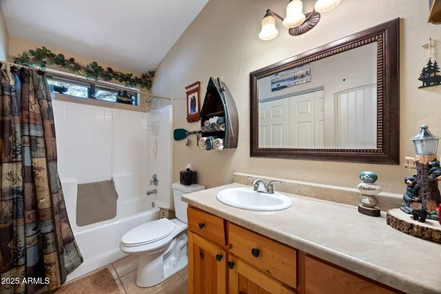 a bedroom with two beds and a window