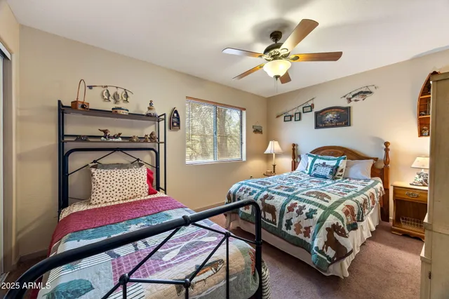 a bathroom with a sink vanity mirror and toilet