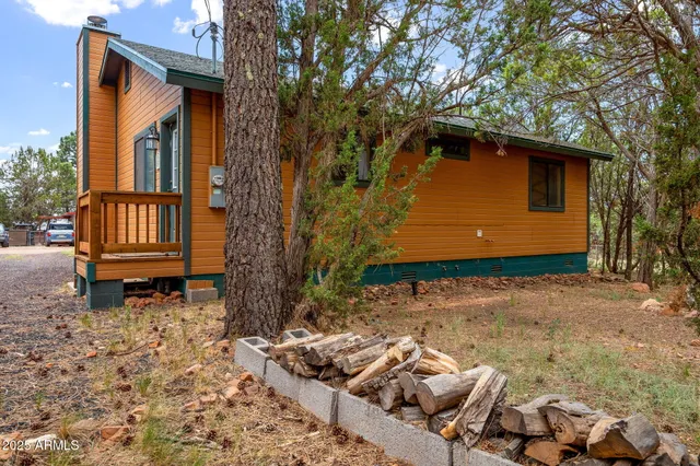 a bedroom with bed and a chandelier