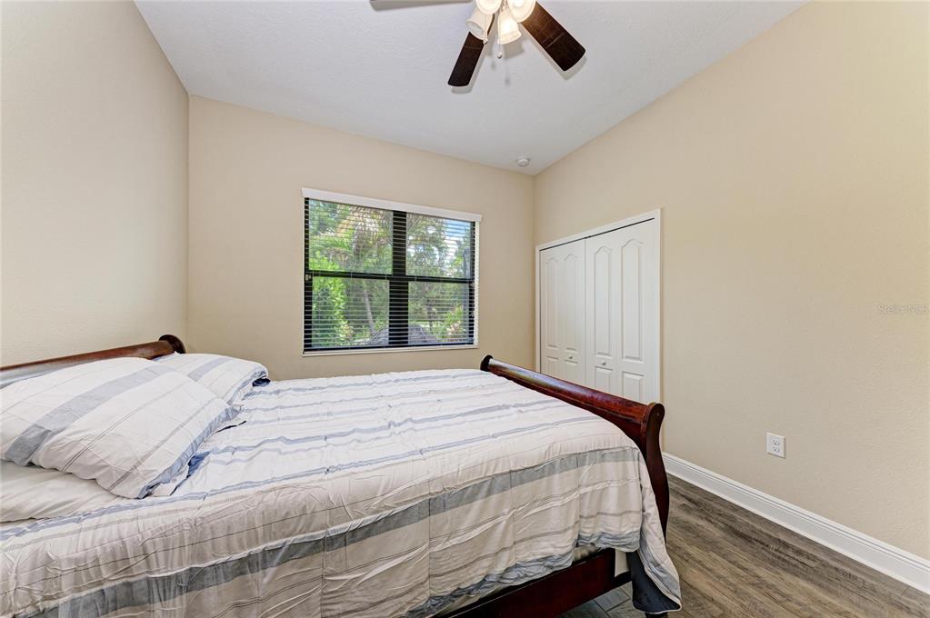 12642 Harney Street Venice, FL 34293 - Photo 35 of 85 a bedroom with a bed and window