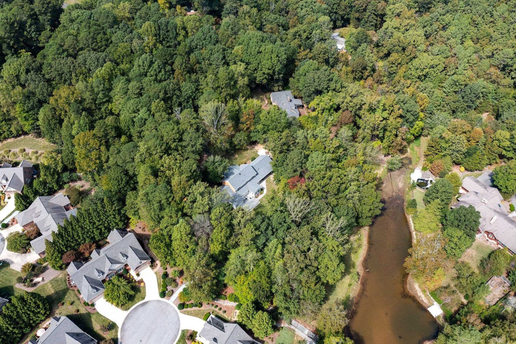 5308 Craig Road Durham, NC 27712 - Photo 12 of 46 an aerial view of residential houses with outdoor space and trees