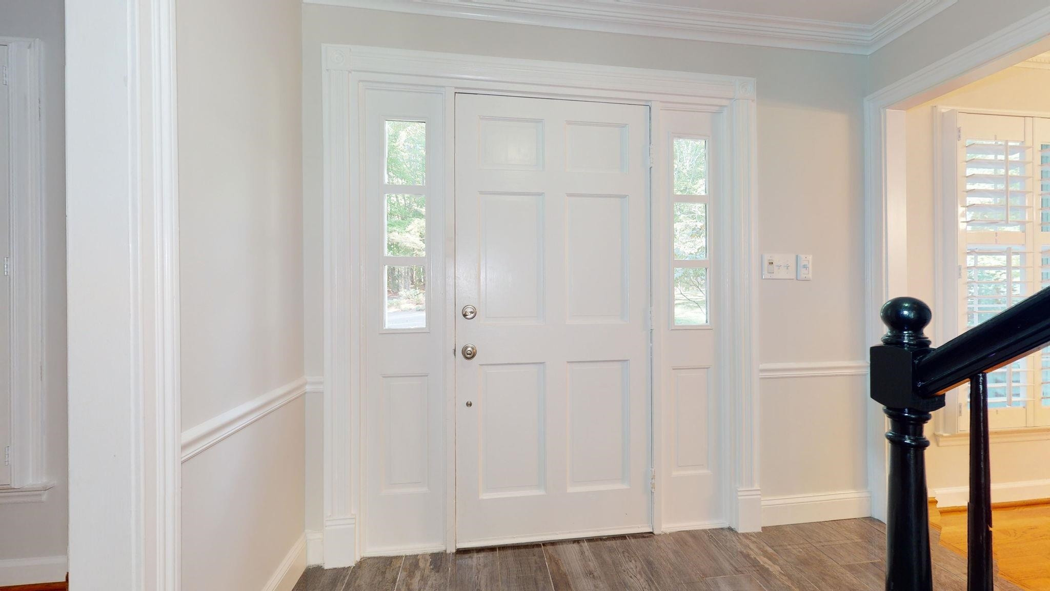 5308 Craig Road Durham, NC 27712 - Photo 15 of 46 a view of front door with wooden floor
