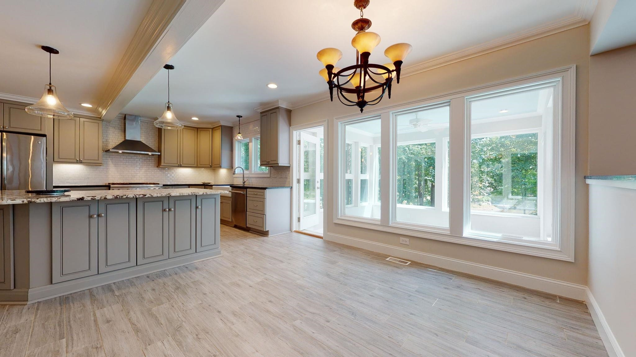 5308 Craig Road Durham, NC 27712 - Photo 17 of 46 a view of a kitchen with a sink stainless steel appliances and cabinets
