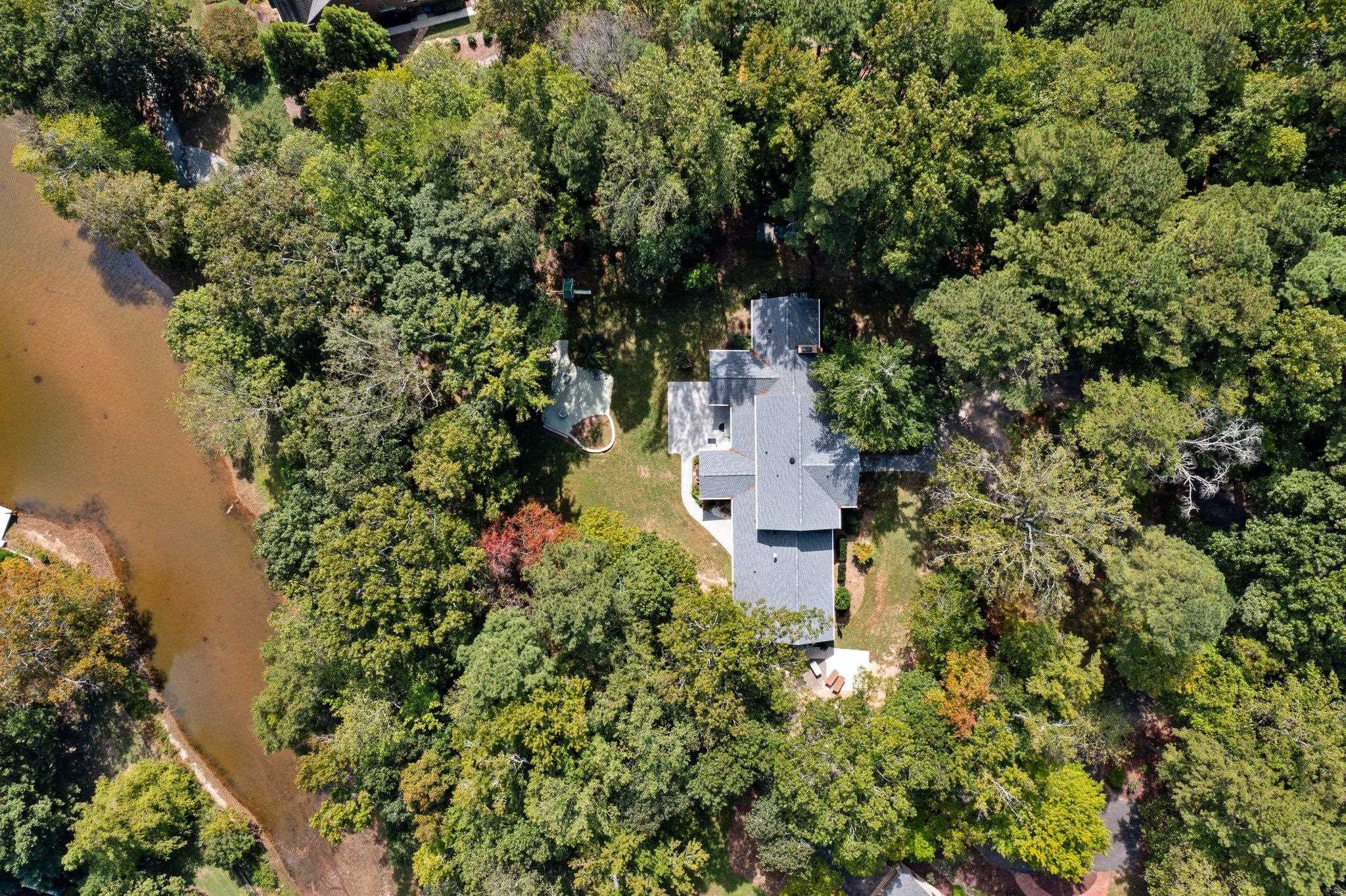5308 Craig Road Durham, NC 27712 - Photo 2 of 46 an aerial view of a house with a yard and garden