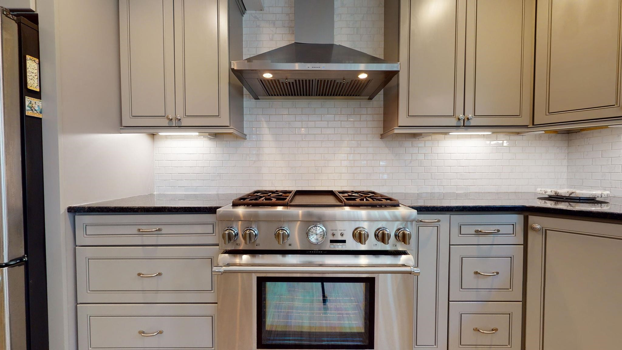 5308 Craig Road Durham, NC 27712 - Photo 21 of 46 a stove top oven sitting inside of a kitchen