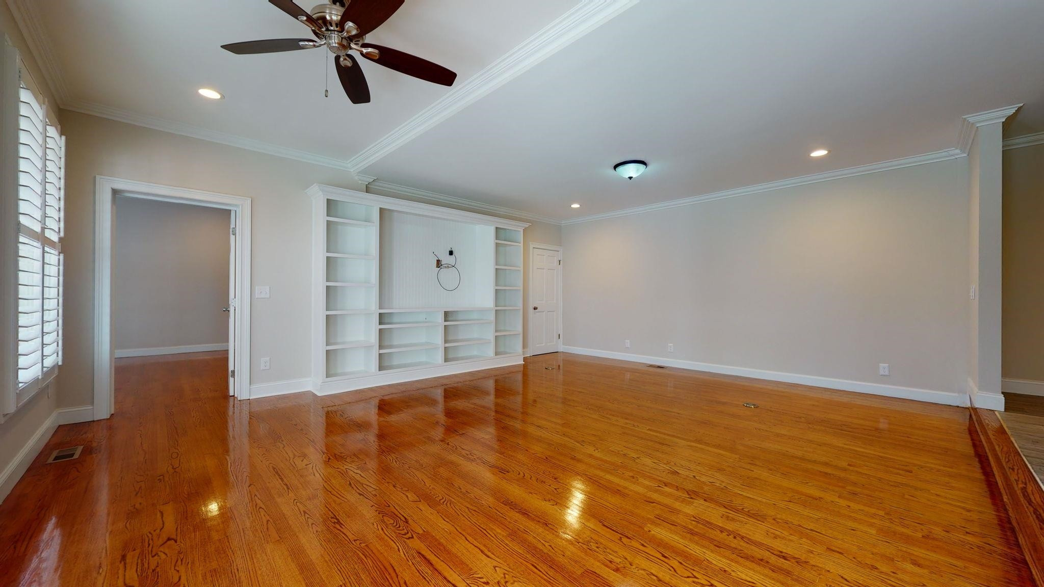 5308 Craig Road Durham, NC 27712 - Photo 24 of 46 a view of an empty room with wooden floor and a window