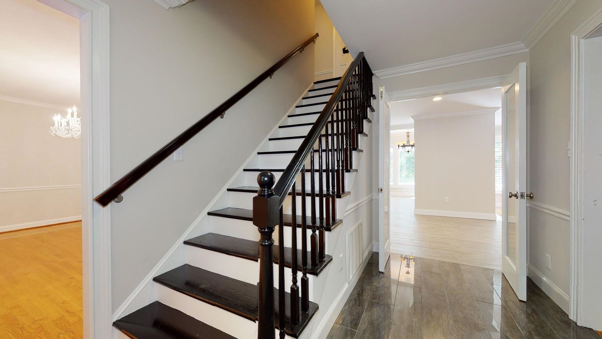 5308 Craig Road Durham, NC 27712 - Photo 27 of 46 a view of entryway with wooden floor and stairs