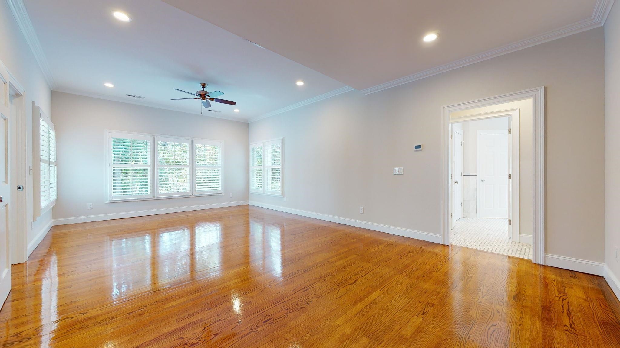 5308 Craig Road Durham, NC 27712 - Photo 30 of 46 a view of an empty room with wooden floor and a window