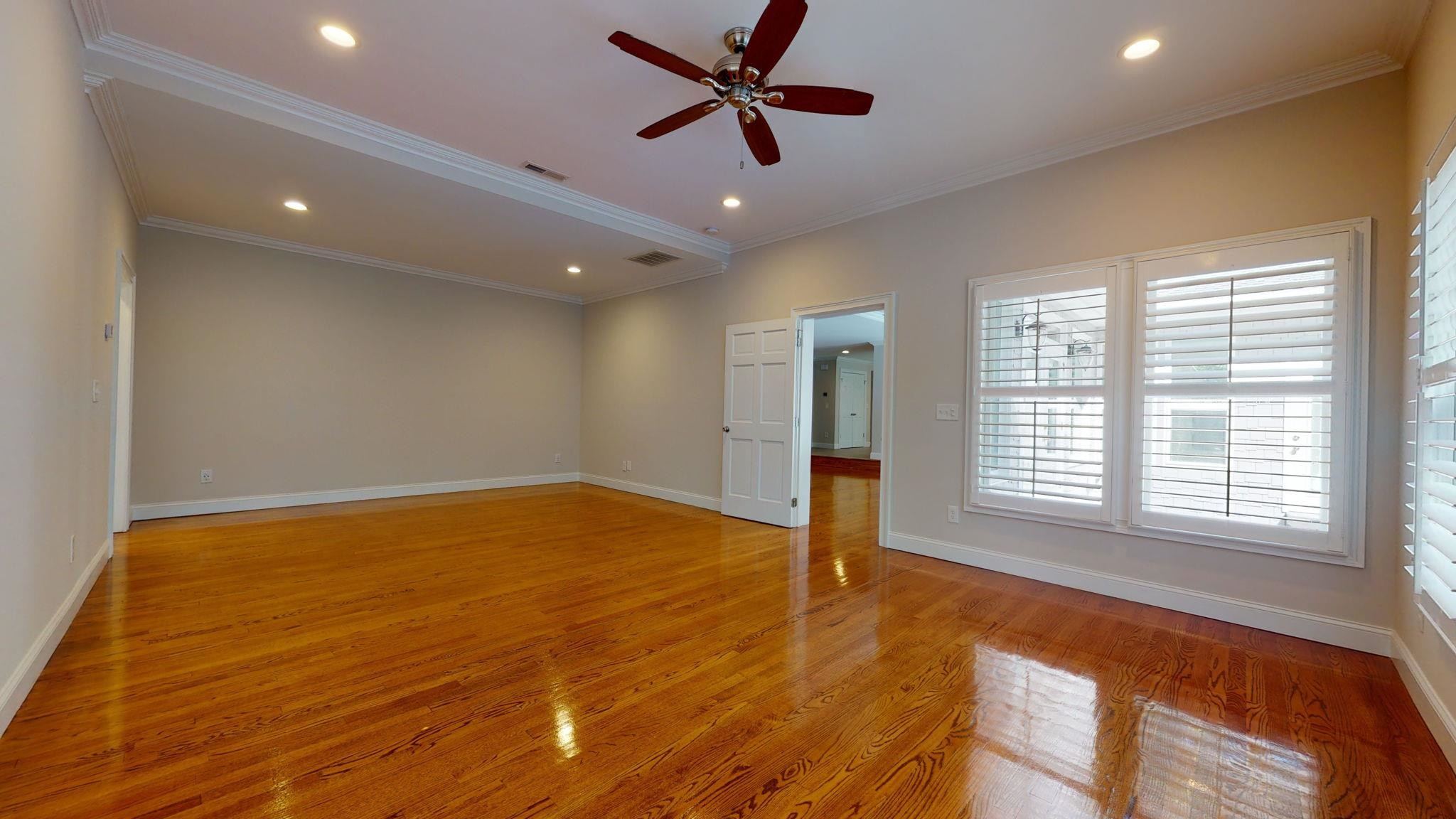 5308 Craig Road Durham, NC 27712 - Photo 31 of 46 a view of an empty room with a window and a ceiling fan