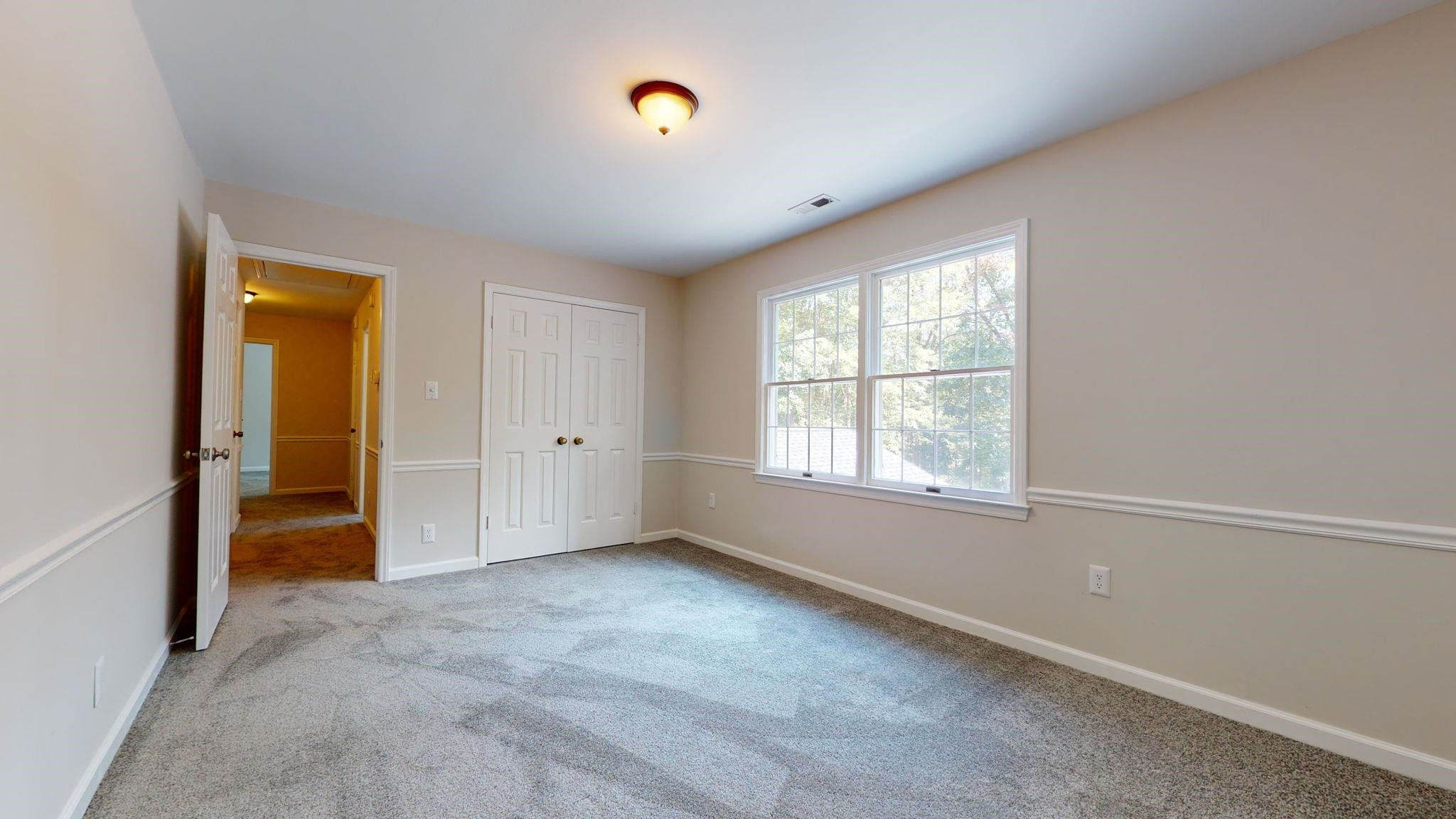 5308 Craig Road Durham, NC 27712 - Photo 40 of 46 an empty room with windows