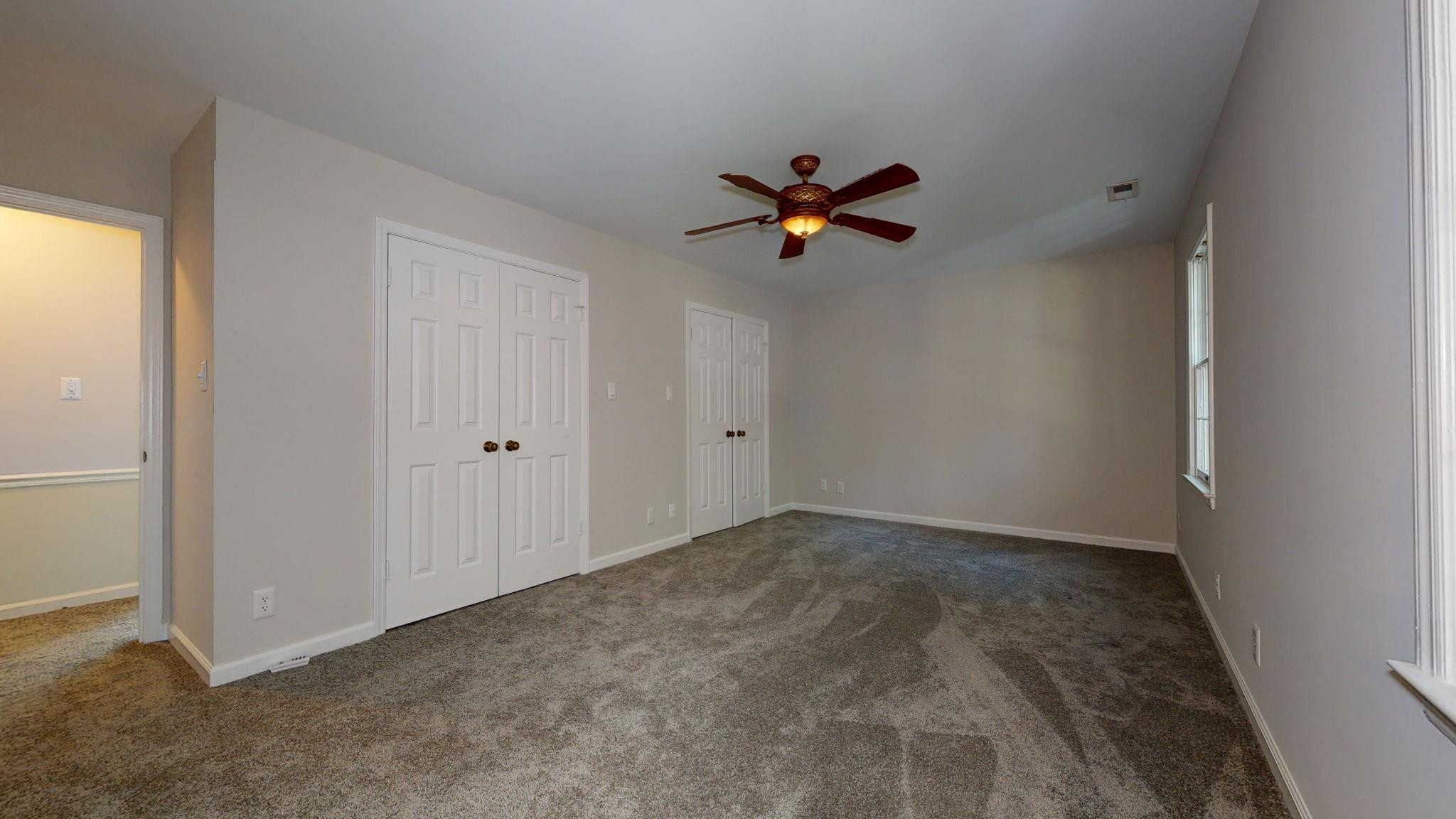 5308 Craig Road Durham, NC 27712 - Photo 41 of 46 a view of room with a ceiling fan and window