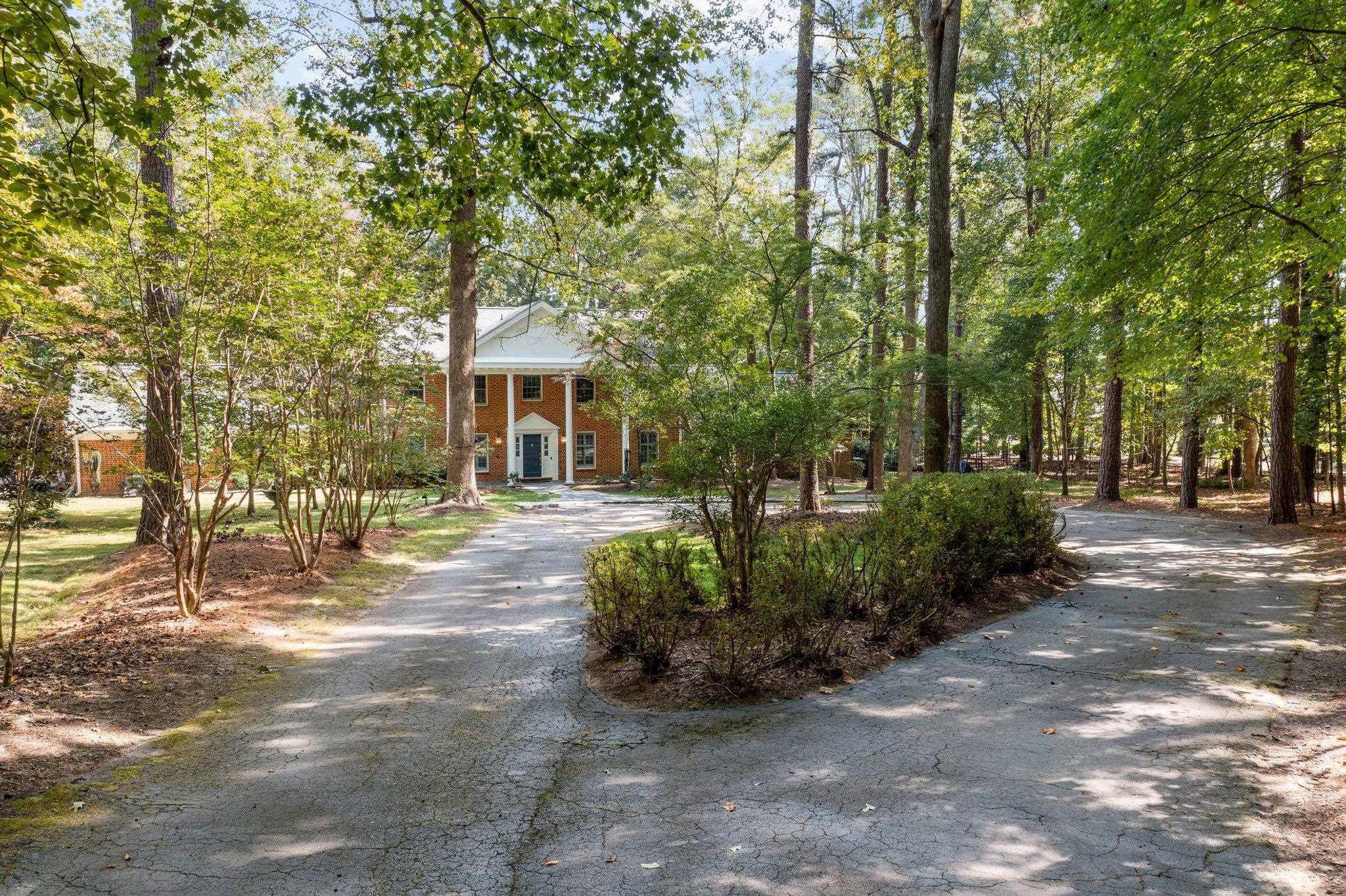 5308 Craig Road Durham, NC 27712 - Photo 6 of 46 a front view of a house with a yard