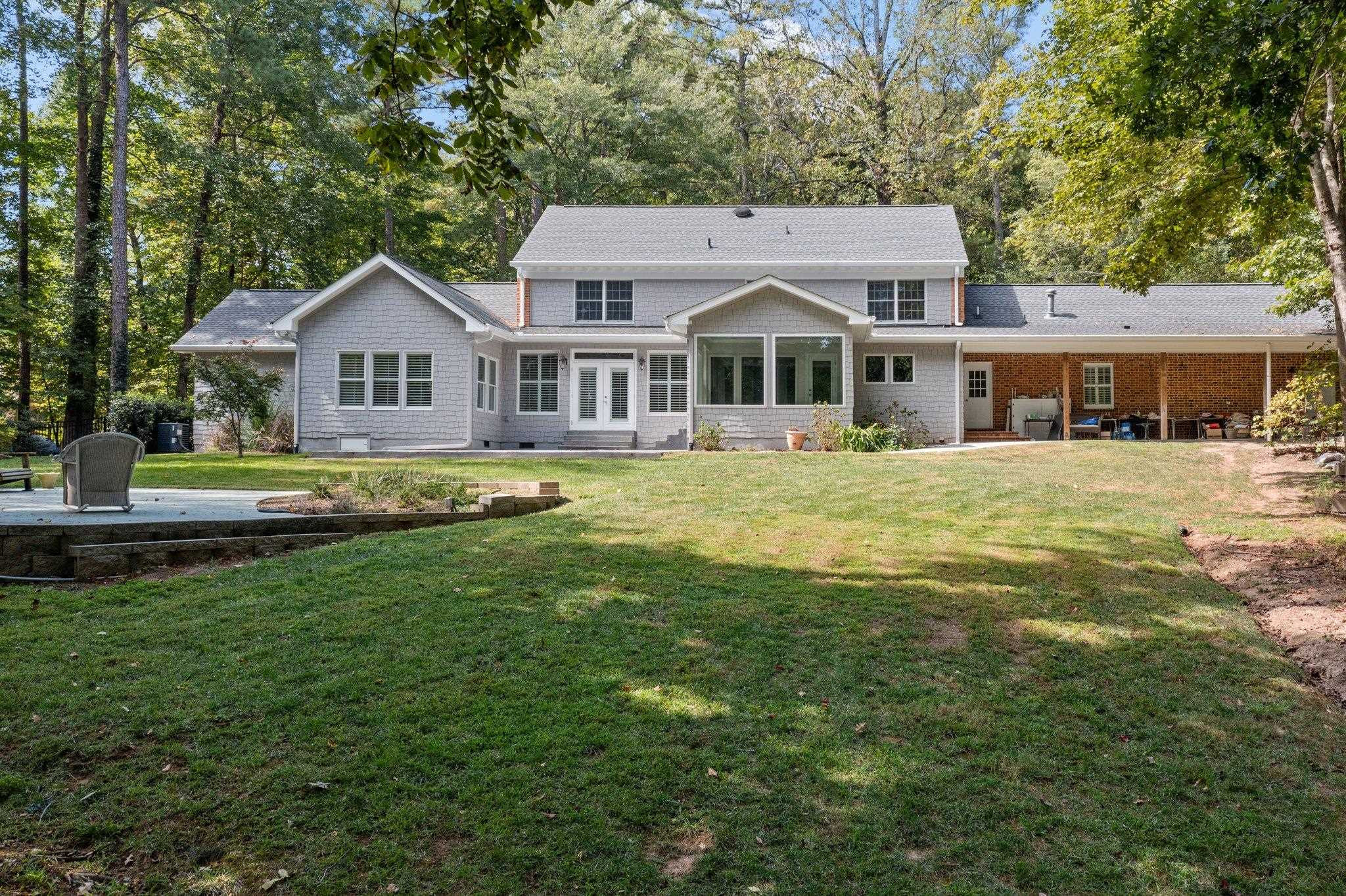5308 Craig Road Durham, NC 27712 - Photo 7 of 46 a front view of a house with a garden
