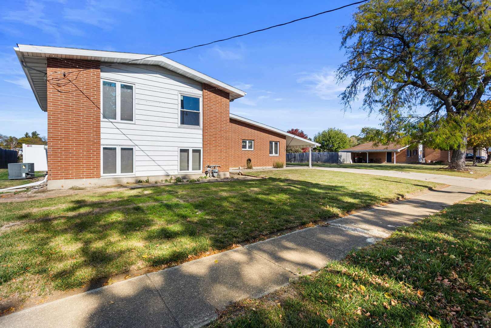 1554 South Pointe Drive Rantoul, IL 61866 - Photo 2 of 39 a view of a house with a yard