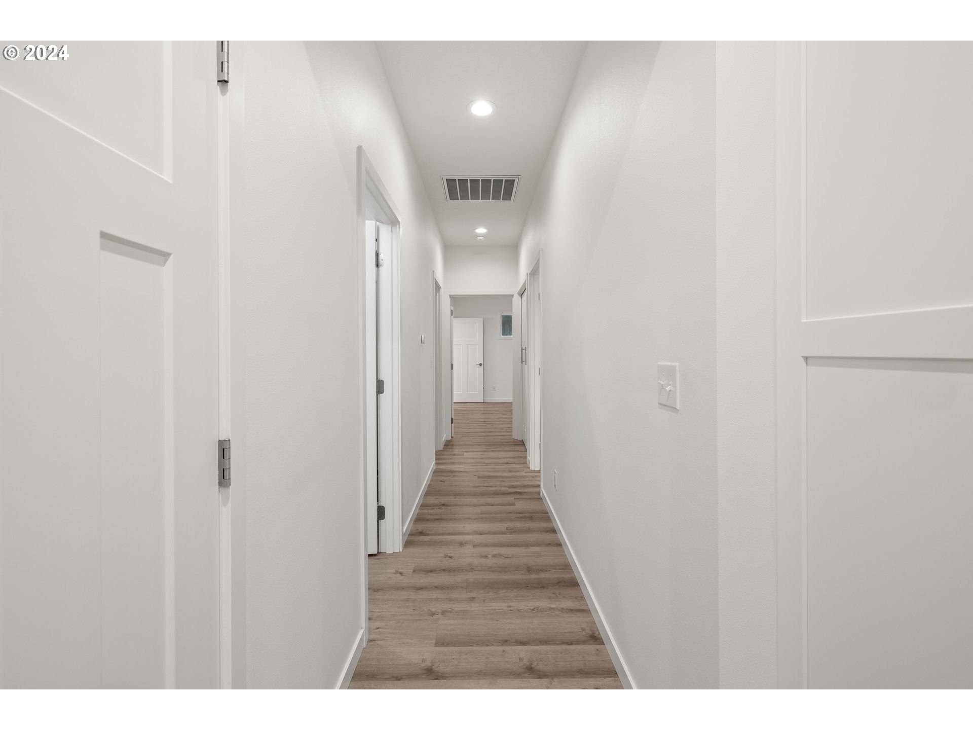 23300 Northwest Bravo Road Buxton, OR 97109 - Photo 19 of 47 a view of a hallway with wooden floor