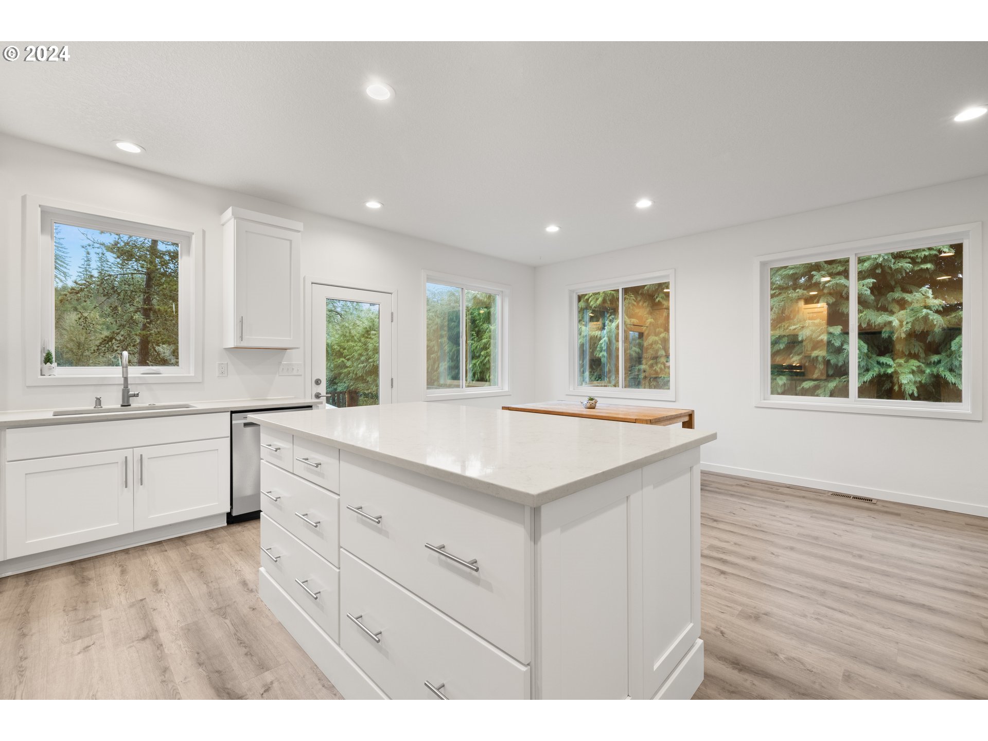 23300 Northwest Bravo Road Buxton, OR 97109 - Photo 23 of 47 a kitchen with a sink window and cabinets