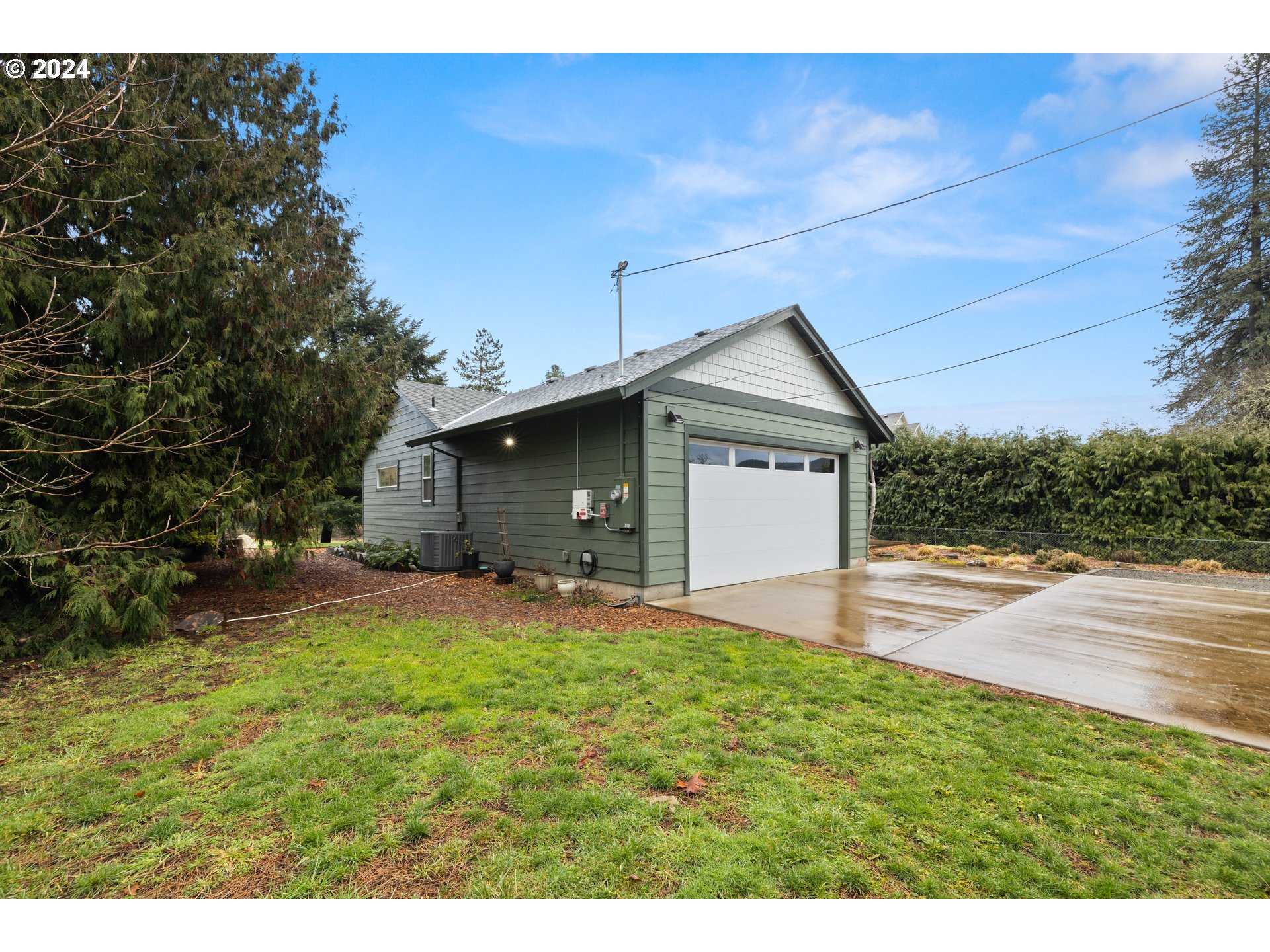 23300 Northwest Bravo Road Buxton, OR 97109 - Photo 37 of 47 a view of a house with a yard and garage