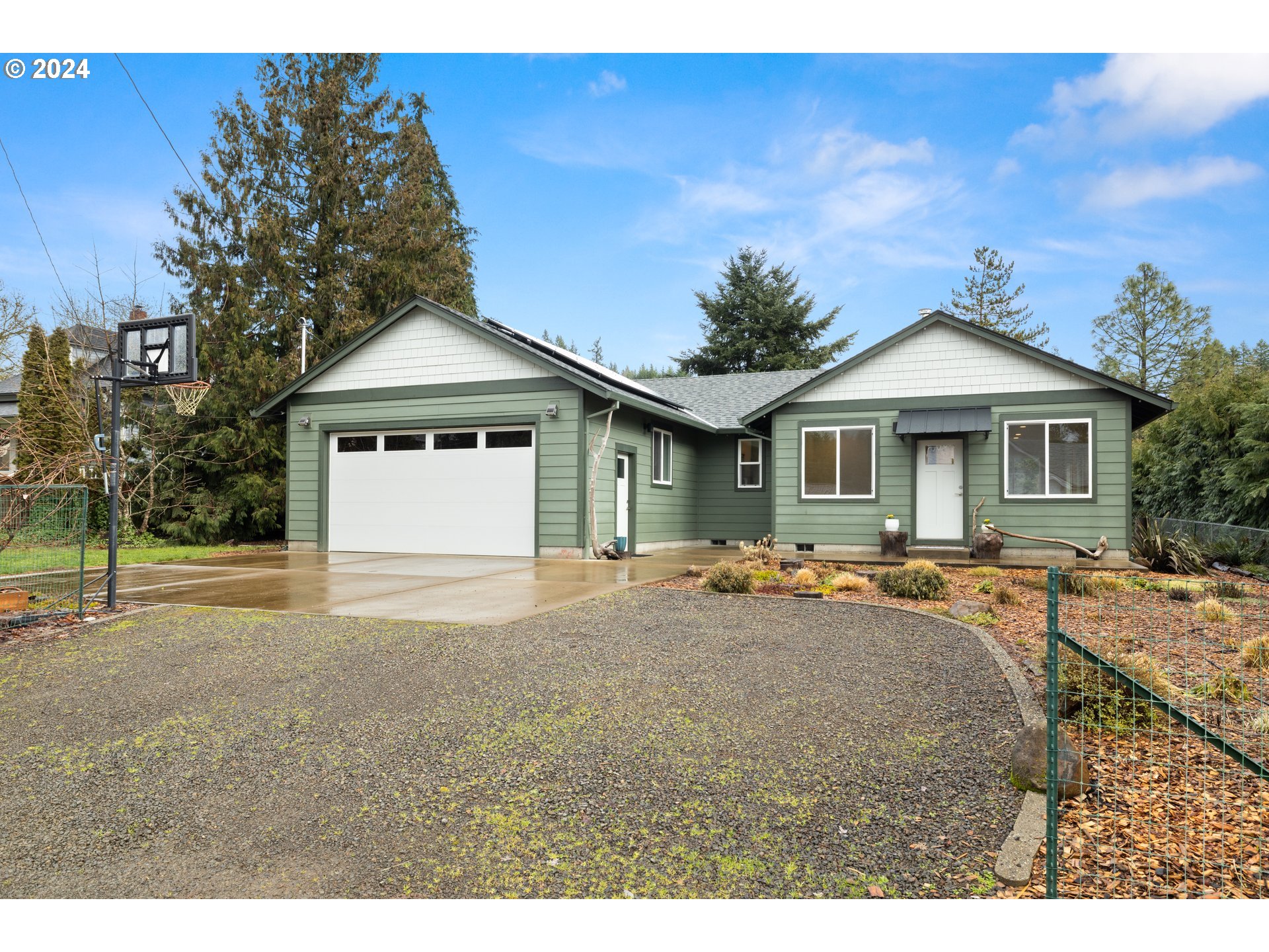 23300 Northwest Bravo Road Buxton, OR 97109 - Photo 38 of 47 a front view of a house with a garden