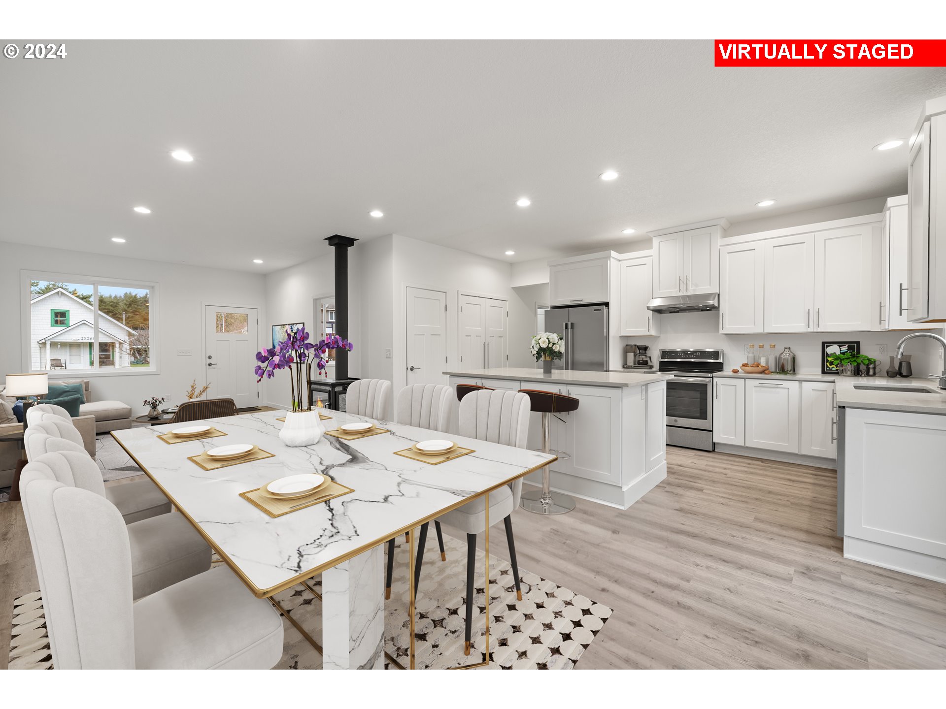 23300 Northwest Bravo Road Buxton, OR 97109 - Photo 5 of 47 a open dining room with kitchen island stainless steel appliances kitchen island granite countertop a dining table and chairs