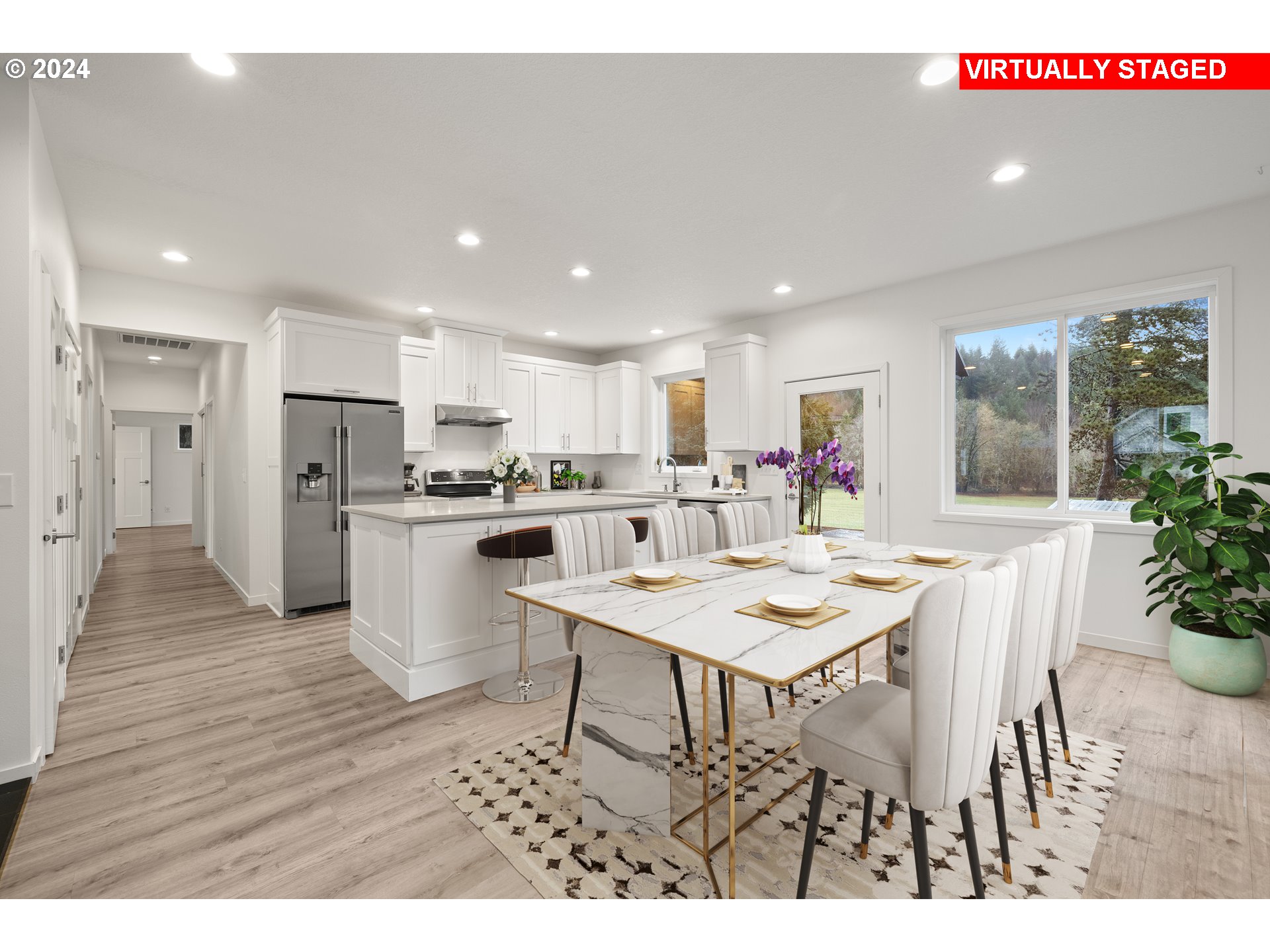 23300 Northwest Bravo Road Buxton, OR 97109 - Photo 6 of 47 a open kitchen with a table and chairs
