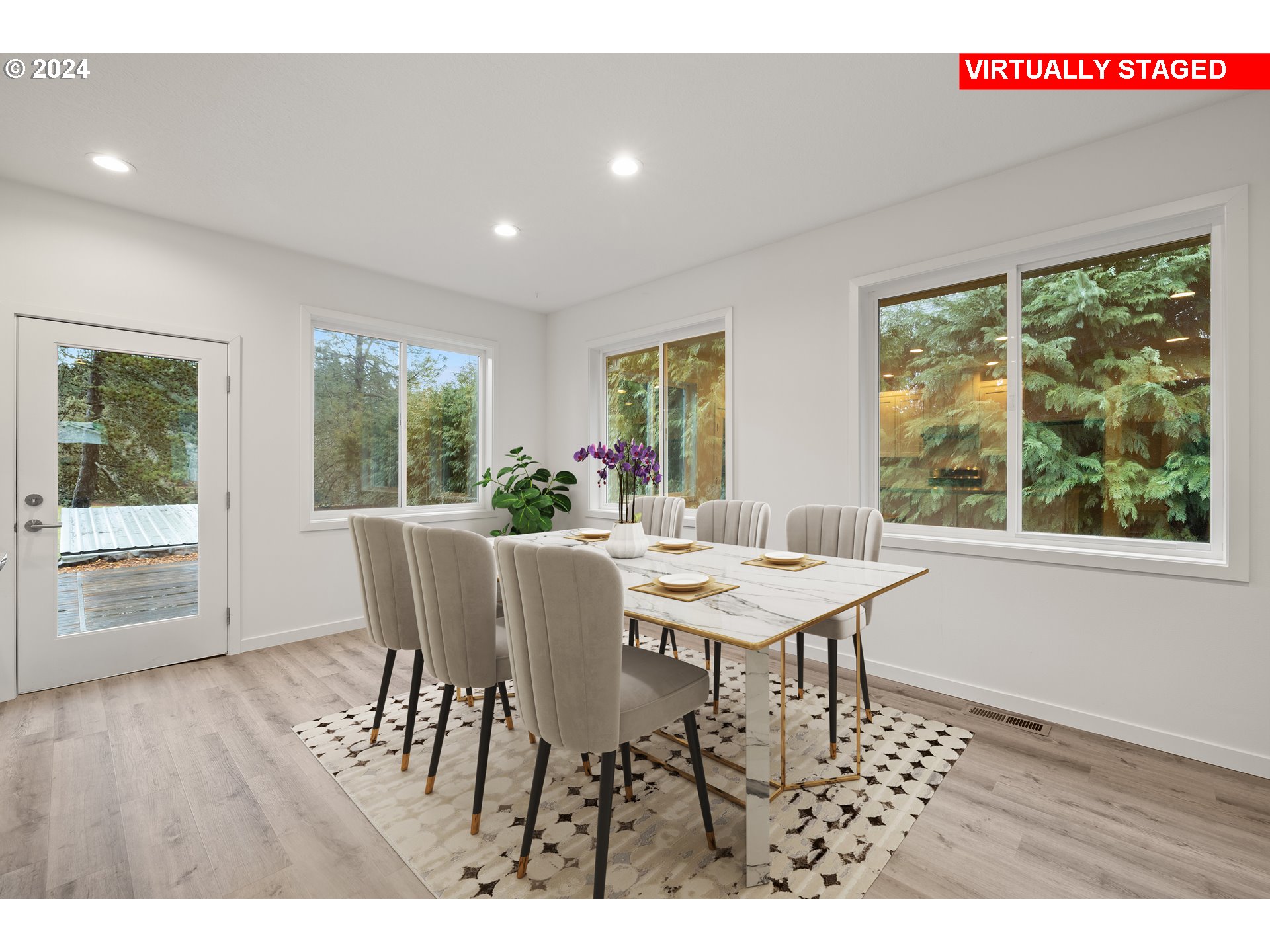 23300 Northwest Bravo Road Buxton, OR 97109 - Photo 8 of 47 a dining room with furniture a rug and wooden floor
