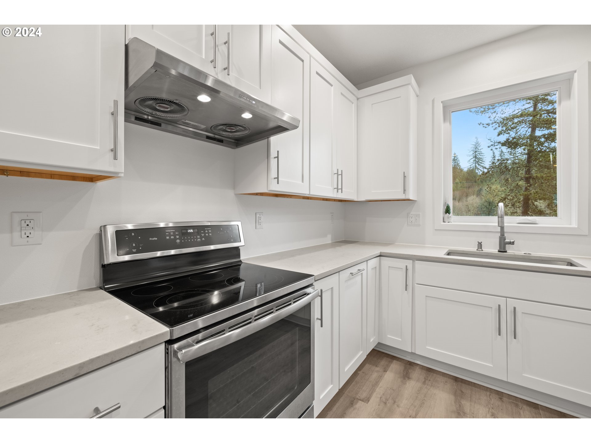 23300 Northwest Bravo Road Buxton, OR 97109 - Photo 9 of 47 a kitchen with a sink and cabinets