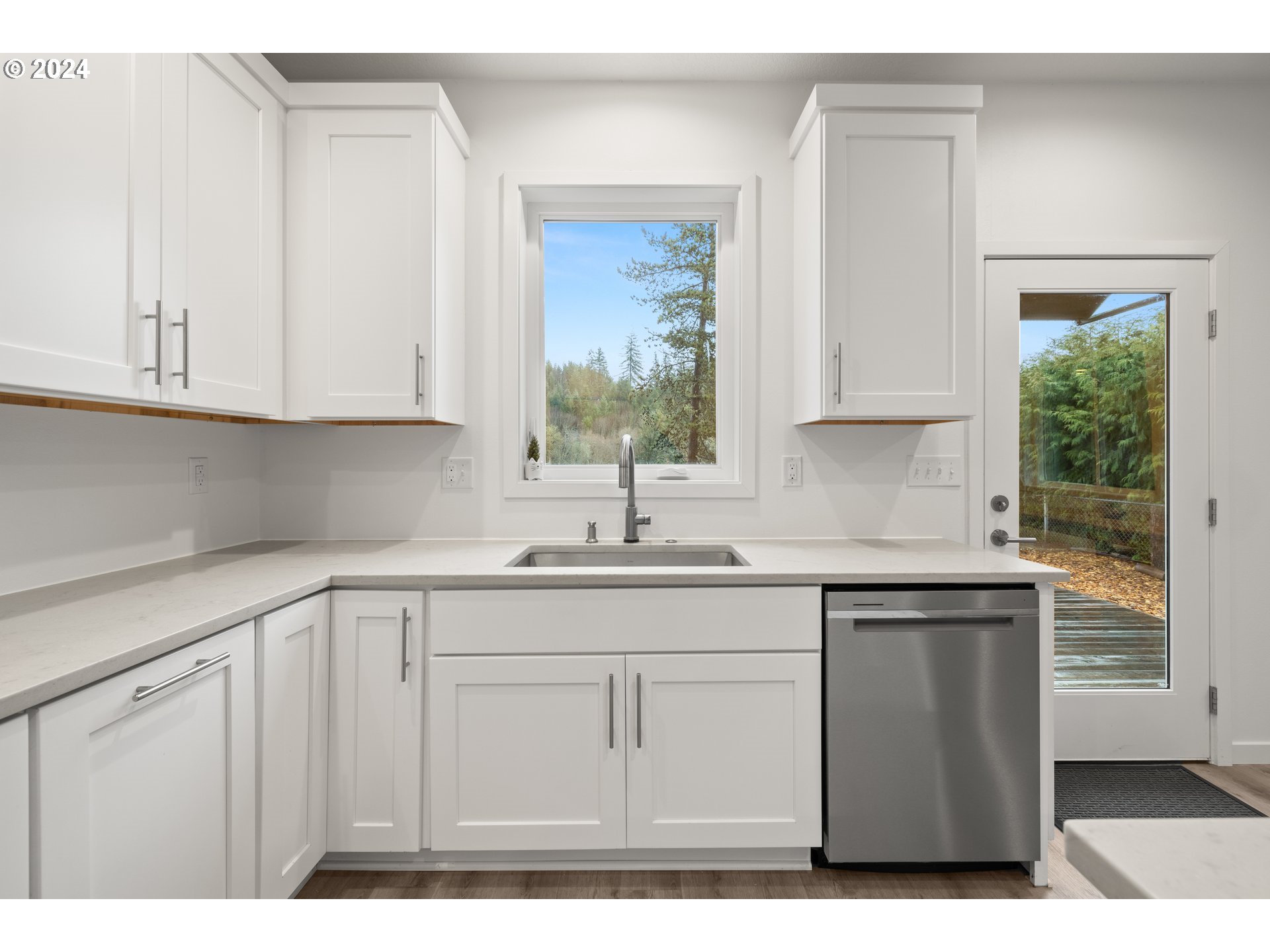 23300 Northwest Bravo Road Buxton, OR 97109 - Photo 10 of 47 a kitchen with stainless steel appliances granite countertop a sink a cabinets and a window
