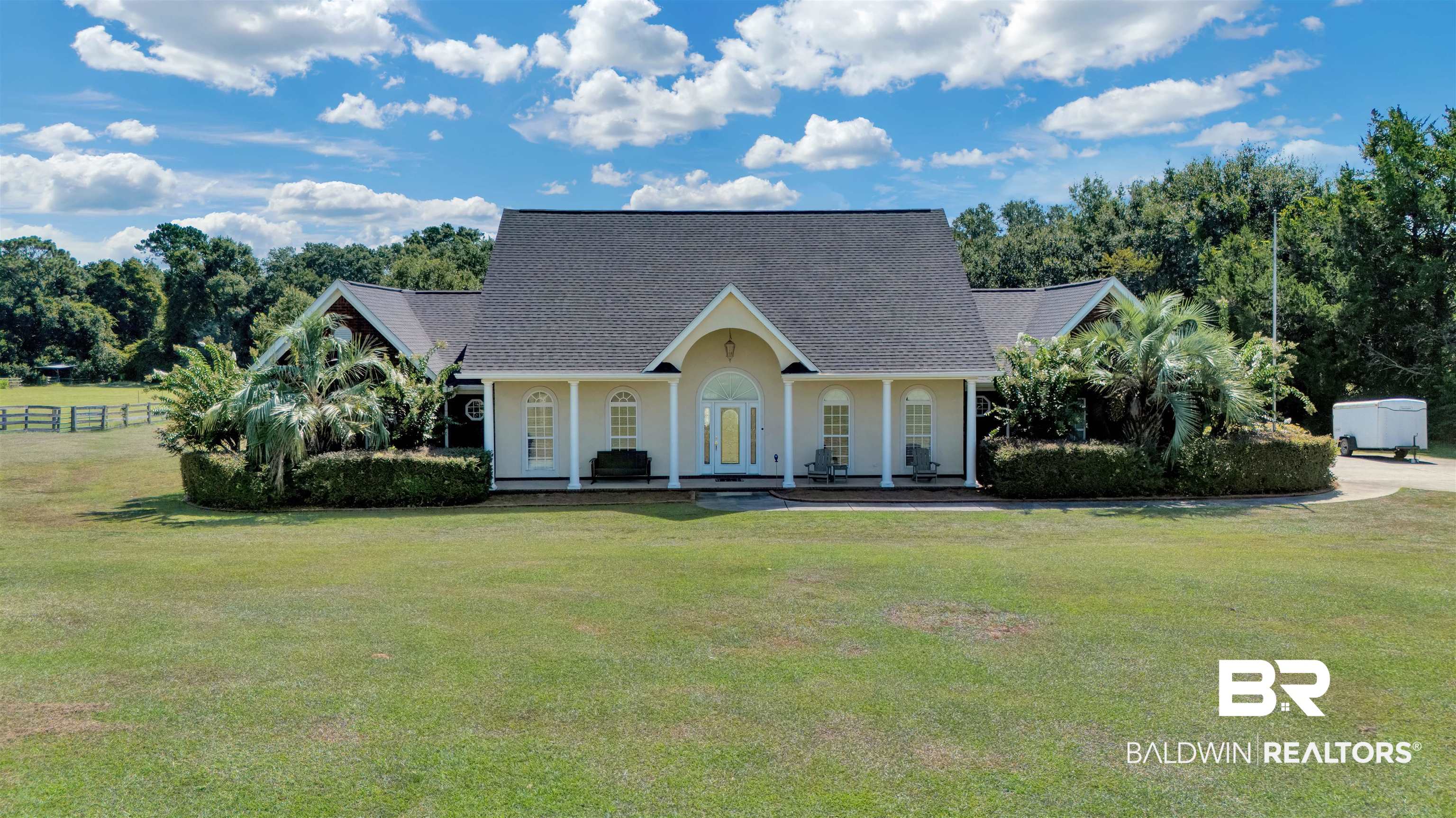 View of front of home featuring a front lawn and a porch