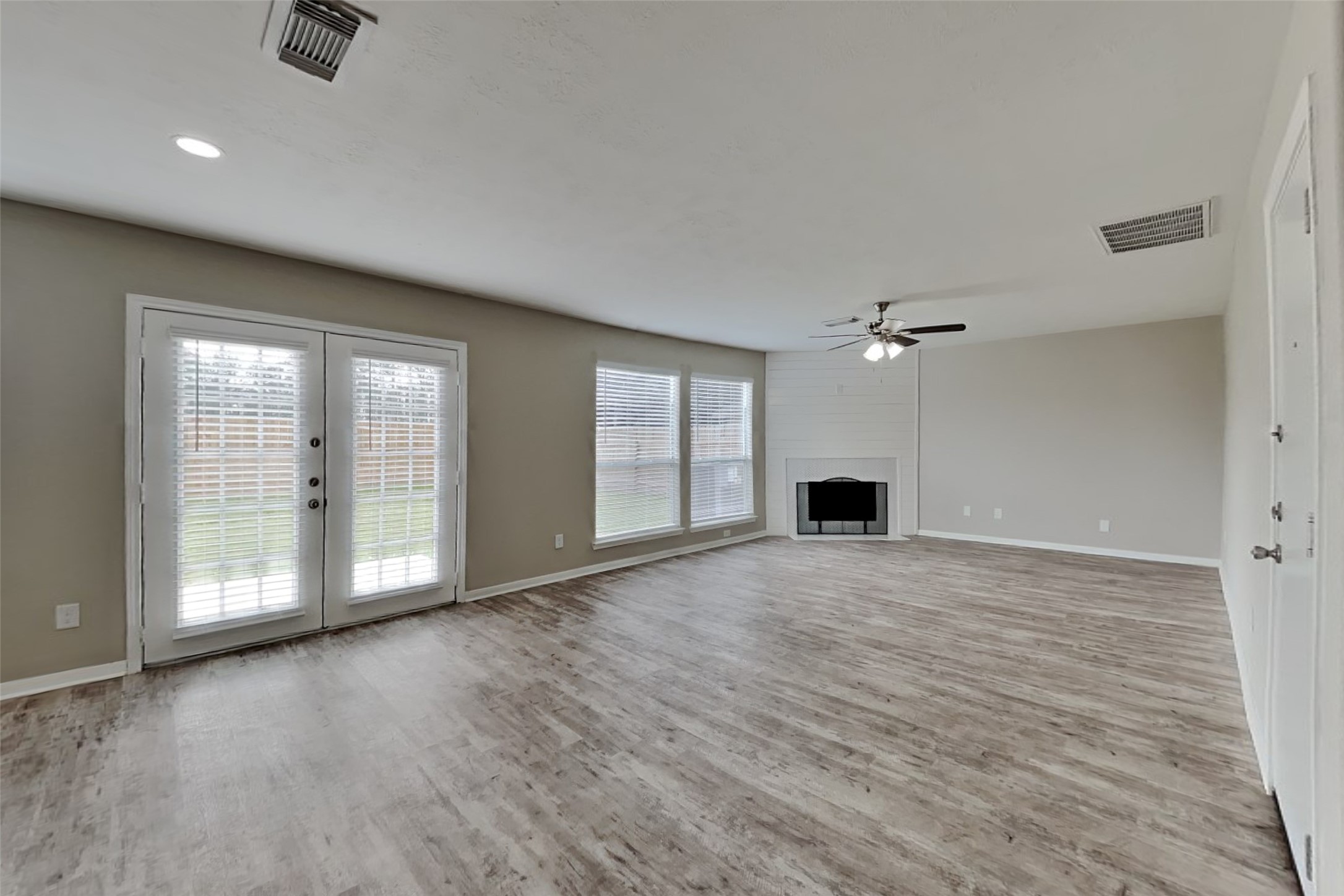2506 Buckminster Drive Spring, TX 77386 - Photo 4 of 22 a view of an empty room with a fireplace and a window