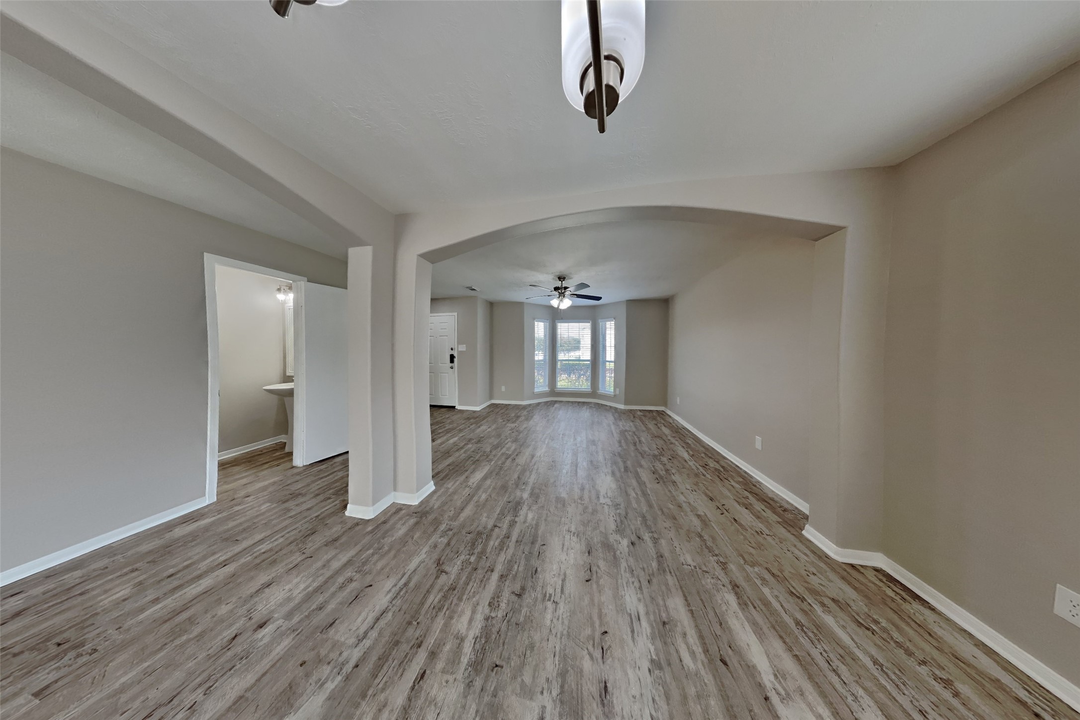 2506 Buckminster Drive Spring, TX 77386 - Photo 7 of 22 wooden floor in an empty room with a window